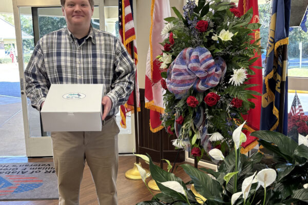 Bake Blue delivering cookies to the area Veterans Home