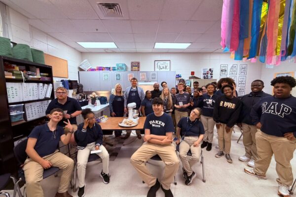 Bake Blue speaking and cooking for the Project Outreach at Baker High School