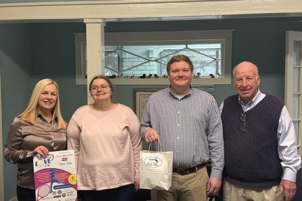 Bake Blue at the Child Advocacy Center in Mobile for the Serve it Up with Love Tournament meeting, pictured with Executive Director Andy Wynn